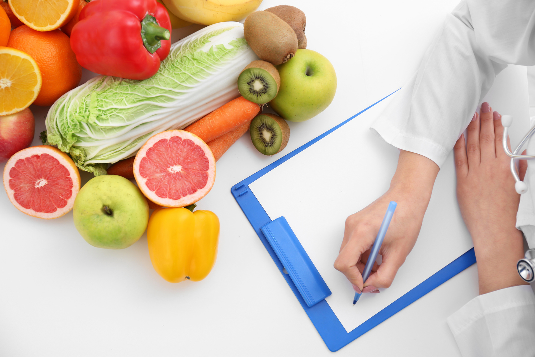 Nutritionist Writing Diet Plan on Table